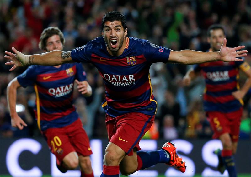 Luis Suarez celebrates after scoring the winning goal for Barcelona in their Champions League match against Bayer Leverkusen this morning