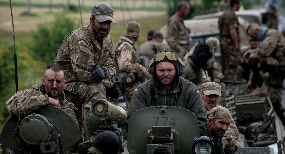 14 2015 Ukrainian servicemen ride atop an armored vehicle near Krasnoarmiisk Donetsk region eastern Ukraine