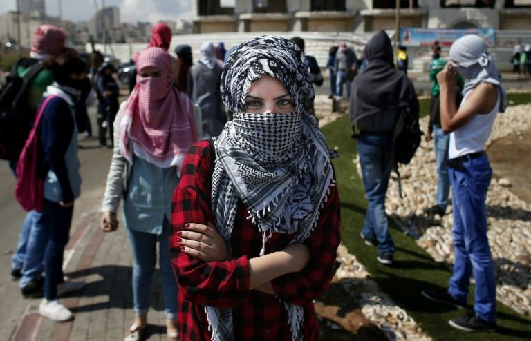 Manicured fingers throwing stones Palestinian women join unrest