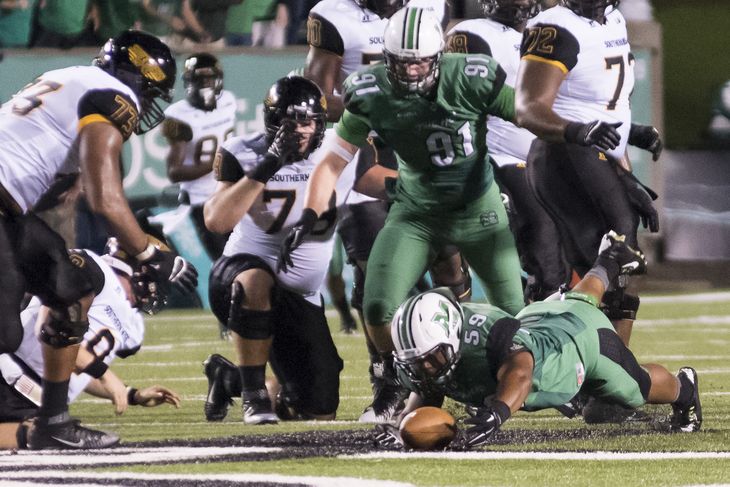 Marshall's Gary Thompson recovers a fumble vs Southern Miss.- Falecia Collier  Collier