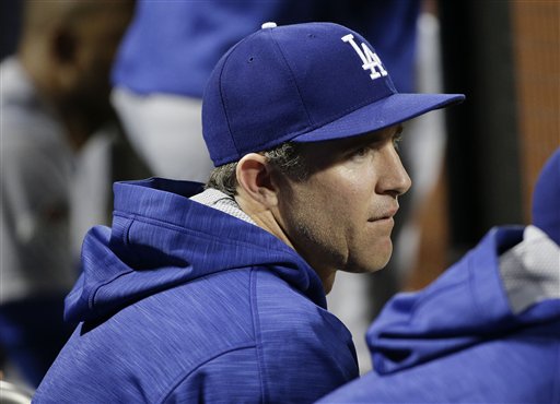 Los Angeles Dodgers&#039 Chase Utley watches play from the dugout during the ninth inning of baseball's Game 3 of the National League Division Series against the New York Mets Tuesday Oct. 13 2015 in New York. The Mets won 13-7. (AP