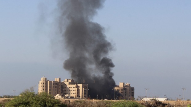 Smoke rises following an explosion that hit Hotel al Qasr where Cabinet members and other government officials are staying in the southern port city of Aden Yemen