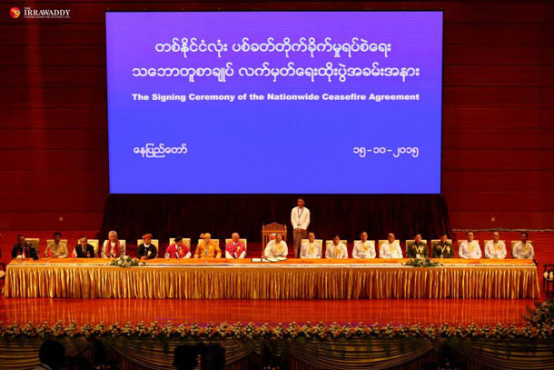 Signatories to the nationwide ceasefire agreement including President Thein Sein center at the Myanmar Convention Center in Naypyidaw on Thursday