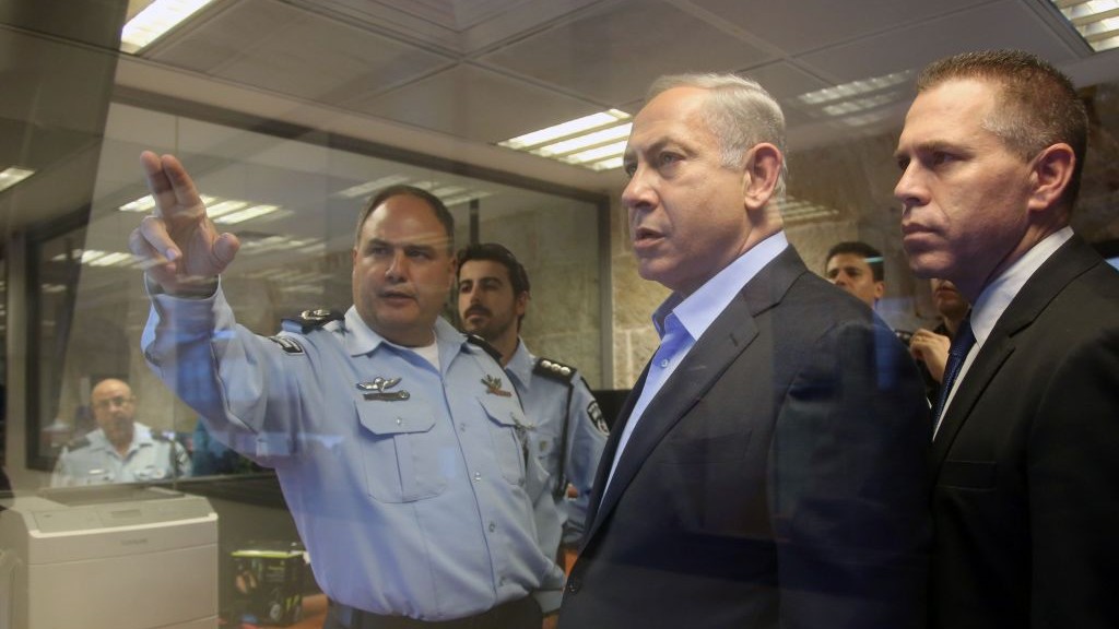 Prime Minister Benjamin Netanyahu center Public Security Minister Gilad Erdan right and Interim police chief Benzi Sau seen during a tour of the Jerusalem police headquarters