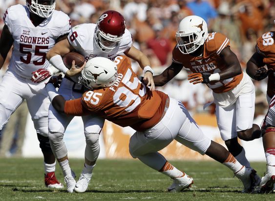 Poona Ford sacks Oklahoma quarterback Baker Mayfield in the first half of an NCAA college football game Saturday Oct. 10 2015 in Dallas