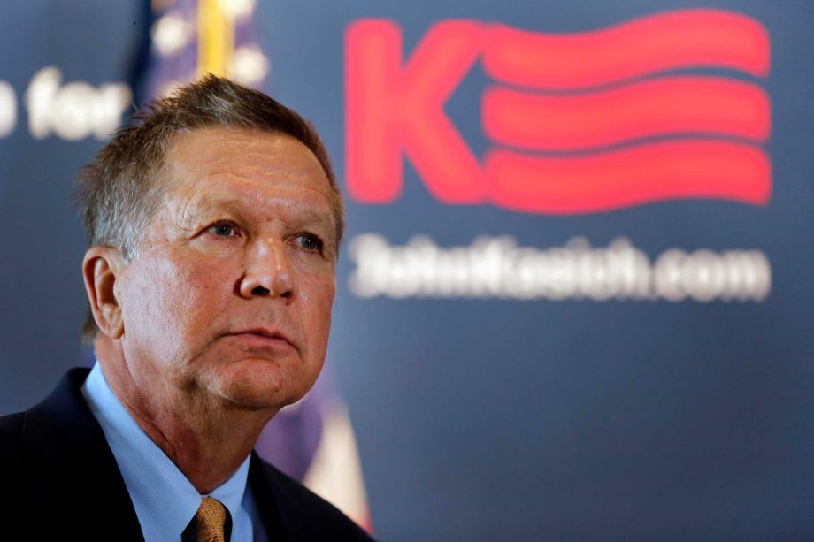 Republican presidential candidate Ohio Gov. John Kasich listens as he gets the endorsement of former New Hampshire Sen. Gordon Humphrey Friday Oct. 2 2015 in Concord N.H