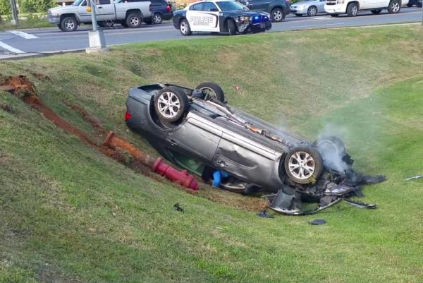 Woman sings about Jesus after ramming two NC police cars, witness says