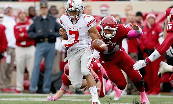 BLOOMINGTON IN- OCTOBER 03 Jalin Marshall #7 of the Ohio State Buckeyes fumbles the ball while defended by Marcus Oliver #44 of the Indiana Hoosiers at Memorial Stadium