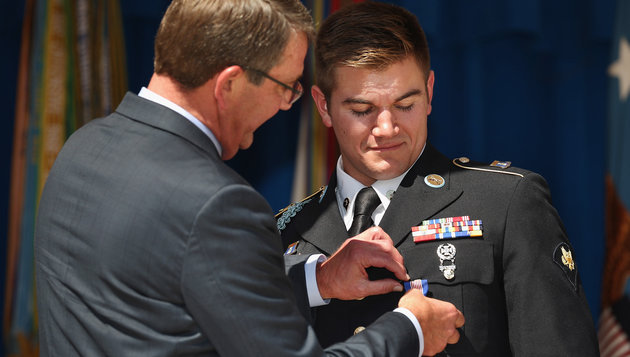 Oregon Army National Guardsman specialist Alek Skarlatos received the Soldier's Medal for helping to stop a gunman on a Paris-bound train in August. On Thursday he wished he'd been home in Oregon for the Umpqua shooting