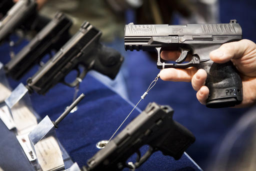 A handgun is displayed during a convention in Reno Nevada on Jan. 29 2011