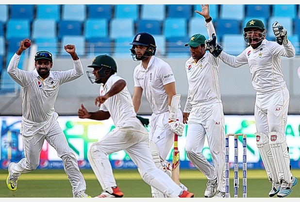 England late order batsman Mark Wood is finally out after an innings lasting 95 balls to the delight of the Pakistan players during the second Test in Dubai