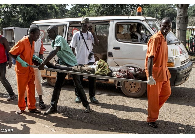 Paramedics in Bangui transporting a victim of the violence.- AFP