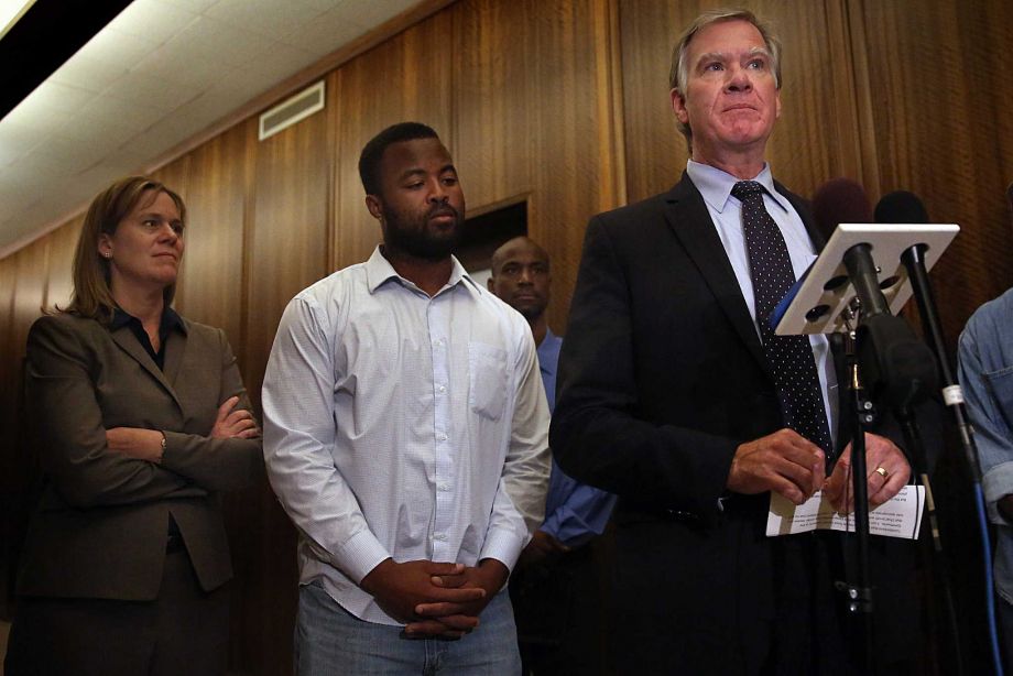 Rashad Turner second from left the leader of the St. Paul chapter of Black Lives Matter joins St. Paul Mayor Chris Coleman right and Saint Paul Deputy Mayor Kristin Beckmann during a news conference following a meeting Thursday morning Oct. 1 2015