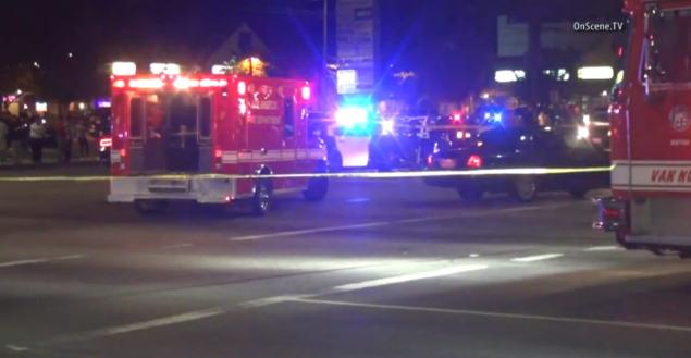 Police investigate after the fatal shooting in the Van Nuys area of Los Angeles on Saturday night in this screenshot from