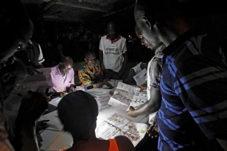 Polling officials count the ballots during a presidential election in Conakry Guinea