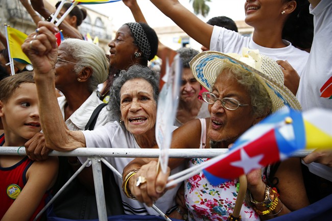 Cubans strain to get close to Pope Francis as he leaves San Cristobal Cathedral Havana Cuba Sunday Sept. 20 2015. Francis presided over the evening prayer service in Havana