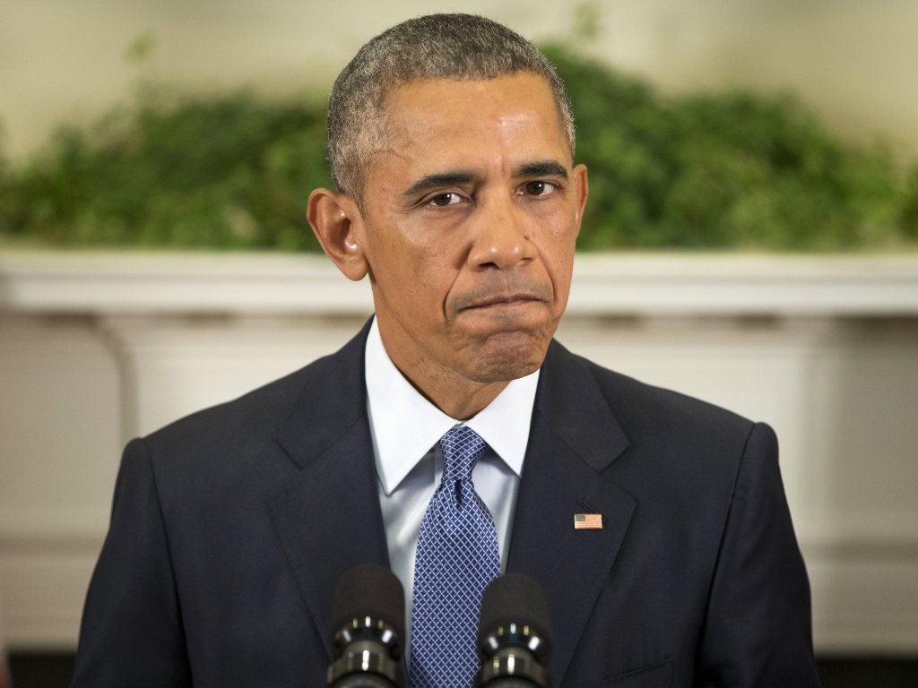 President Obama pauses as he speaks about Afghanistan on Thursday in the Roosevelt Room of the White House.    Pablo Martinez Monsivais    
  AP