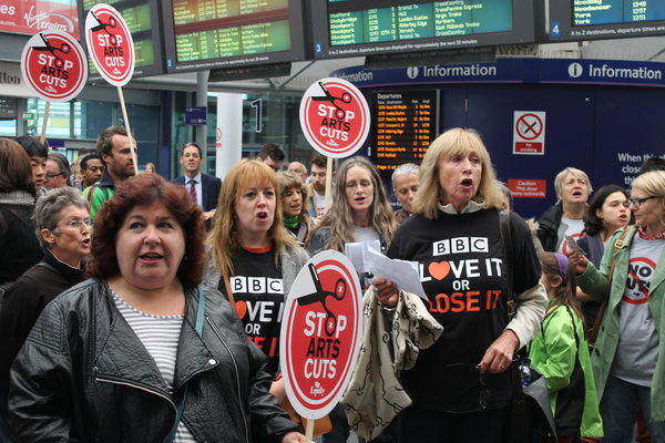 Protesters welcome Tory conference delegates in Manchester Picadilly rail station