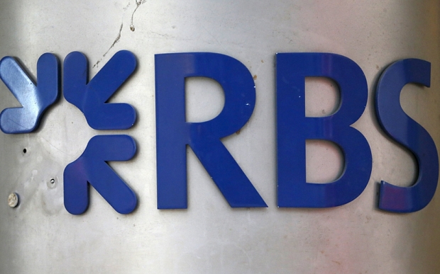 A sign in need of repair is seen outside a branch of the Royal Bank of Scotland in London Britain