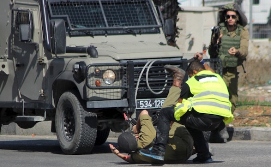 A Palestinian posing as a journalist stabs an Israeli soldier with a knife before being shot dead near the West Bank city of Hebr