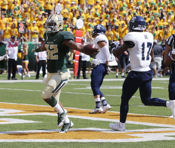 Rod Aydelotte 
 

 
Baylor running back Shock Linwood scores past Rice safety J.T. Ibe in the first half of the Bears’ win last week over the Owls