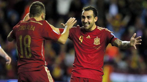 Spain striker Paco Alcacer celebrates his goal with Jordi Alba in Logrono last night