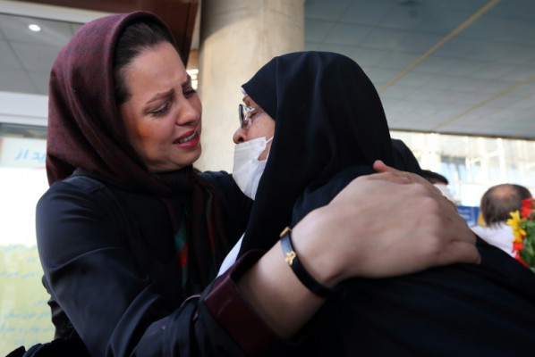 AFP  Atta Kenare An Iranian woman hugs her mother at the Imam Khomeini international airport in Tehran following her return from the hajj in the Saudi city of Mecca