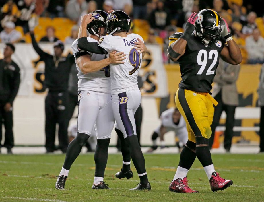 Baltimore Ravens kicker Justin Tucker celebrates with holder Sam Koch after making the game winning field goal in overtime of an NFL football game against the Pittsburgh Steelers Thursday Oct. 1 2015 in Pittsburgh. At right is Steelers outside