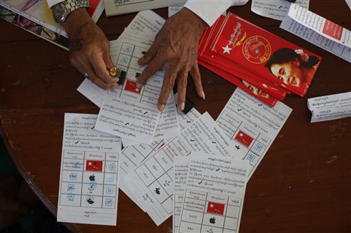 A woman practices how to vote during voter education event lead by members of Myanmar opposition leader Aung San Suu Kyi's National League for Democracy party Thursday Oct 15 2015 in Mandalay Myanmar. Myanmar's general elections are schedul