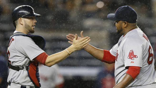 Boston Red Sox catcher Blake Swihart left and relief pitcher Jean Machi celebrate Boston’s 10-4 victory over the New York Yankees in New York on Tuesday