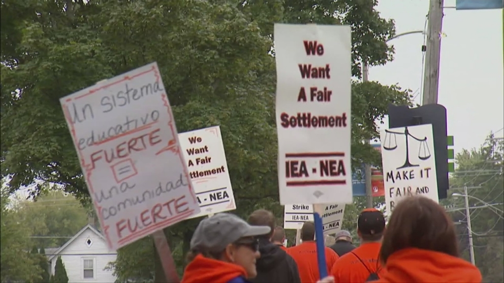 Teachers with Mc Henry Community High School District 156 picket on Monday the third day of a teachers&#039 strike