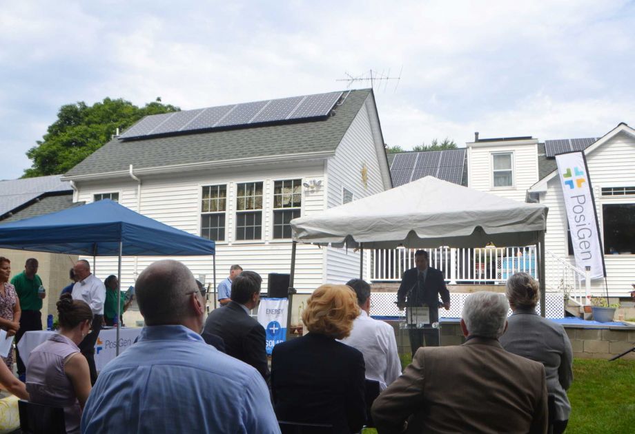 Bryan Garcia CEO of the Connecticut Green Bank speaks in July 2015 at the home of Susan Young in Bridgeport Conn. among the first in Connecticut to install solar power and other energy efficiency measures as part of an incentive program partnered by