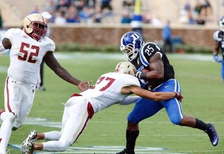 Oct 3 2015 Durham NC USA Duke Blue Devils running back Jela Duncan carries the ball as Boston College Eagles defensive back Justin Simmons tackels at Wallace Wade Stadium. Mandatory Credit Mark Dolejs-USA TODAY Sports