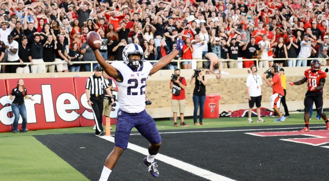 LUBBOCK TX- SEPTEMBER 26 Aaron Green #22 of the TCU Horned Frogs catches a tipped ball in the end zone for the game winning touchdown late in the 4th quarter against the Texas Tech Red Raiders