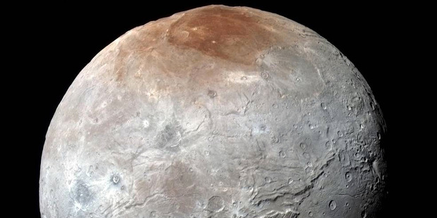 This image released by NASA shows Charon in enhanced color by captured by NASA's New Horizons. Image  supplied