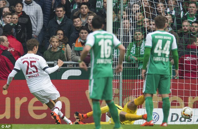 Thomas Muller slots home as Bayern recorded a ninth straight win to stretch their Bundesliga lead