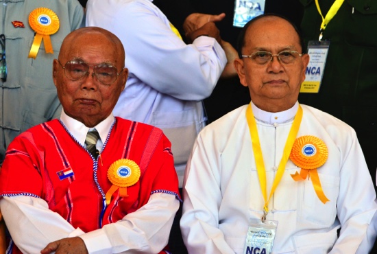 Myanmar President Thein Sein right sits along with Mutu Say Po chairman of Karen National Union, for a group