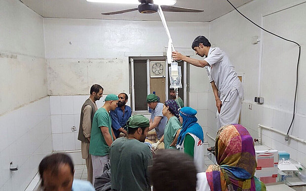 Afghan MSF surgeons work in an undamaged part of the MSF hospital in Kunduz after the operating theatres were destroyed in an air strike