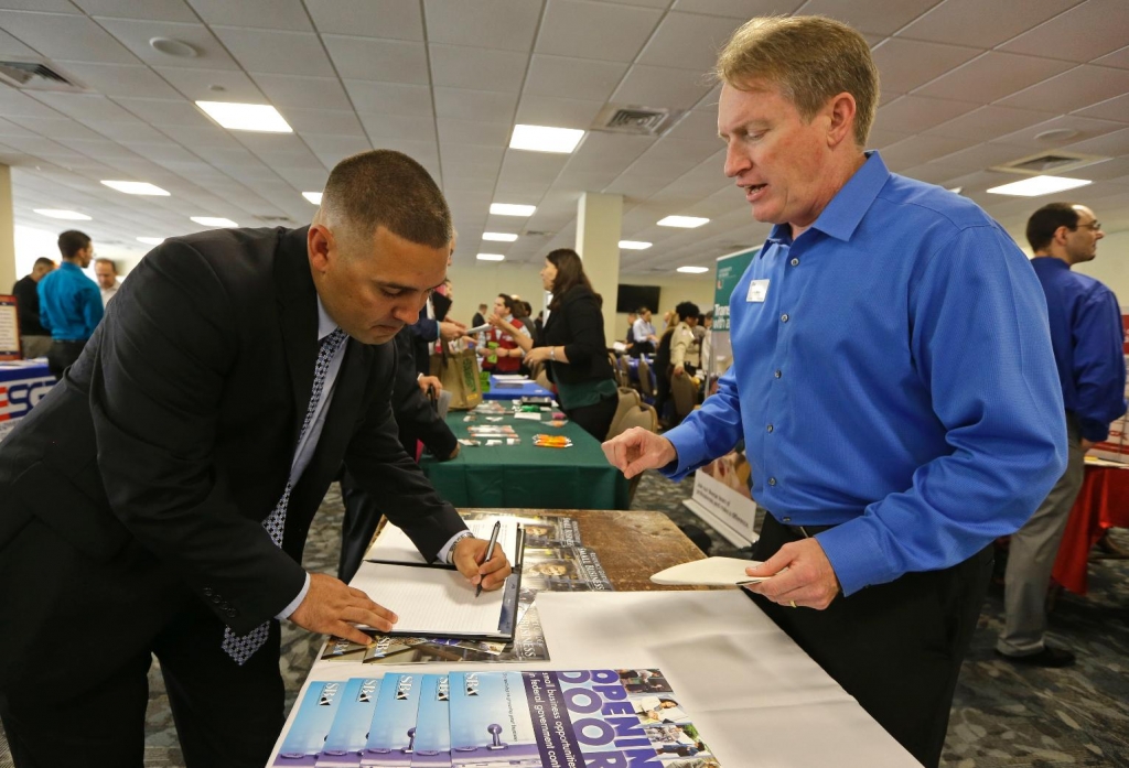 Shaking off turmoil, US firms added 200000 jobs in Sept., ADP says