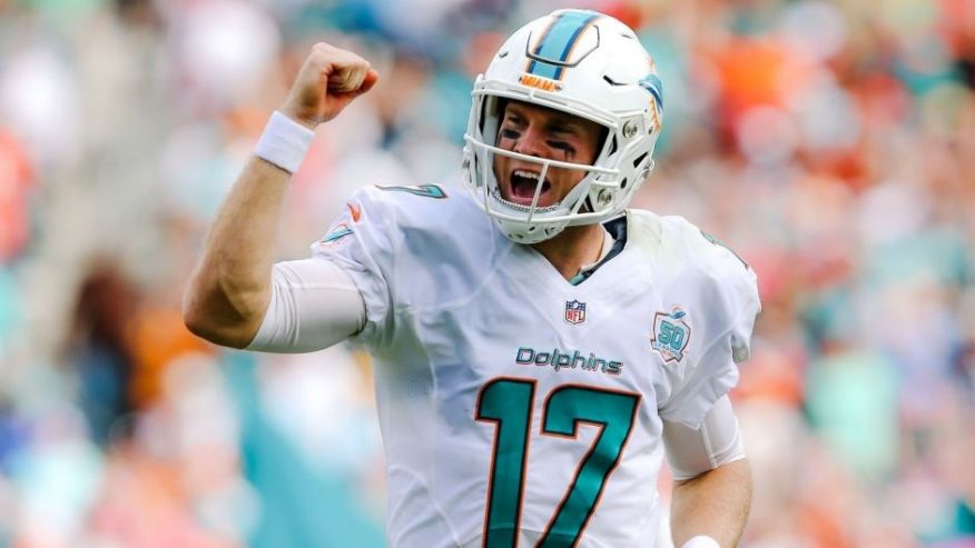 Oct 25 2015 Miami Gardens FL USA Miami Dolphins quarterback Ryan Tannehill celebrates after running back Lamar Miller scors a touchdown against the Houston Texans during the first half at Sun Life Stadium. Mandatory Credit Steve