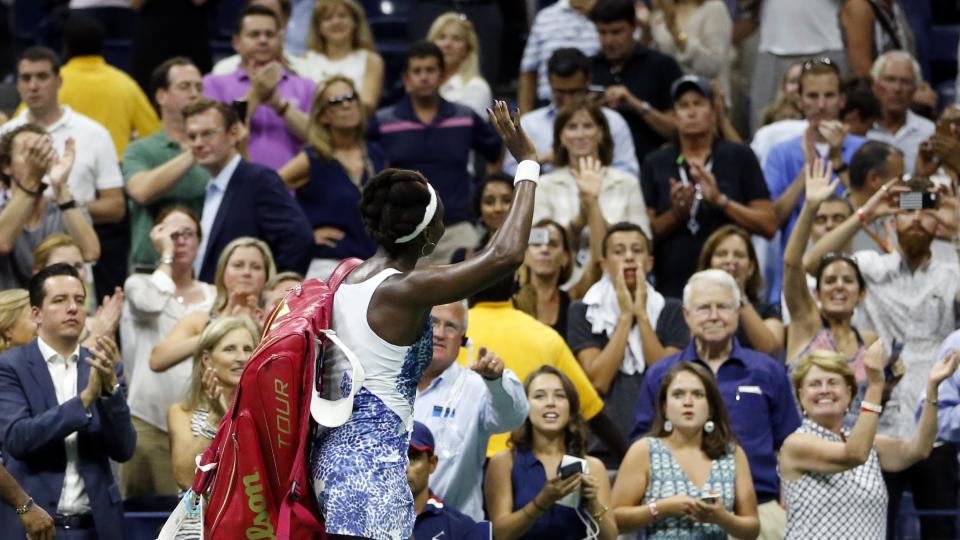 Venus Williams waves to the crowd after losing to Serena Williams during a quarterfinal match at the U.S. Open tennis tournament Tuesday Sept. 8 2015 in New York