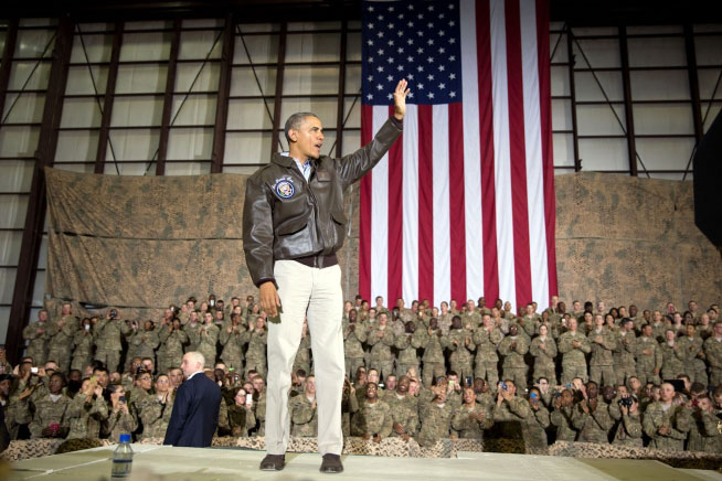 President Barack Obama waves at the conclusion of his remarks to U.S. troops at Bagram Airfield in Bagram Afghanistan Sunday