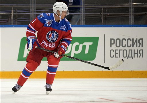 Russian President Vladimir Putin takes part in an ice hockey match between former NHL stars and officials at the Shayba Arena in the Black Sea resort of Sochi Russia Wednesday Oct. 7 2015. Russian President Vladimir Putin spent his 63rd birthday on