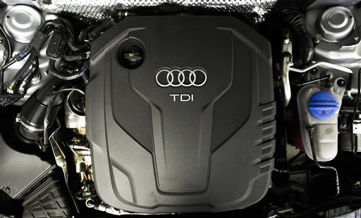 The sign of German car company Audi is attached on the engine of a TDI a turbo diesel model in Berlin Germany Monday Sept. 28 2015. Volkswagen AG's upmarket Audi brand said 2.1 million of its vehicles are among those with the engines affected