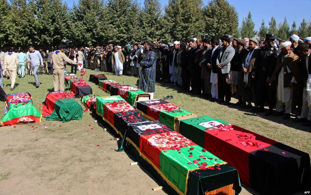 Funeral services were held for 12 Afghan schoolgirls who died trying to flee their school during the quake