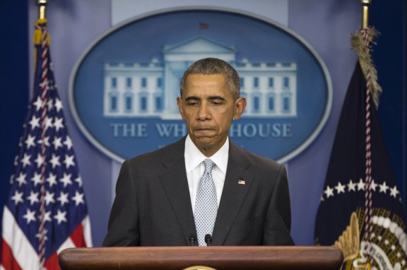 President Barack Obama pauses as he speaks about attacks in Paris from the briefing room of the White House