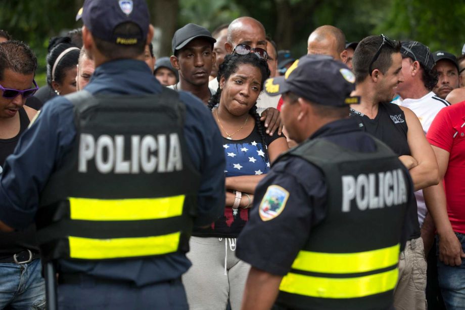 Cuban migrants take part in a protest blocking the Pan American Highway demanding access to Nicaragua in Peñas Blancas Costa Rica Tuesday Nov. 17 2015. More than 1,000 Cuban migrants heading north to the United States tried to cross the border from