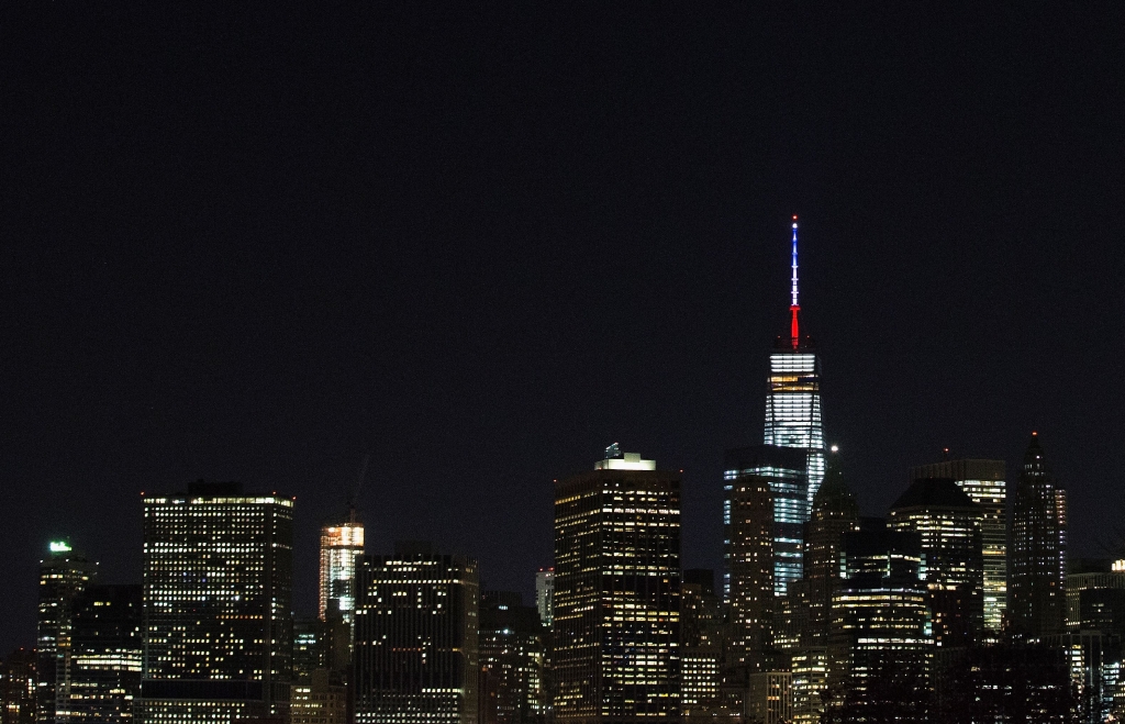 One World Trade Center's spire One World Trade Center's spire is shown lit in French flags colors of white blue and red in solidarity with France after tonight's terror attacks in Paris Friday night