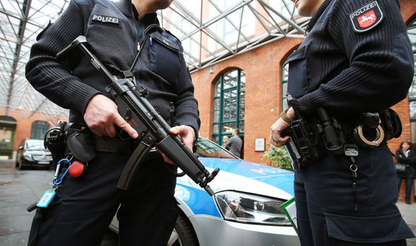 Armed German police stand guard at hotel