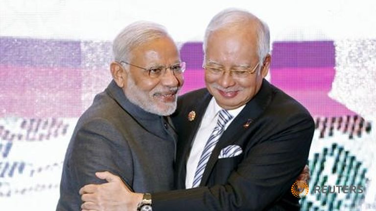 India's Prime Minister Narendra Modi embrace Malaysia's Prime Minister Najib Razak in Kuala Lumpur